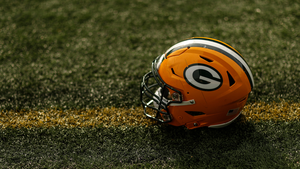 Green Bay Packers helmet resting on field