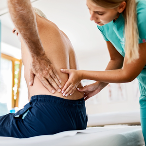 Physiotherapist working on back pain